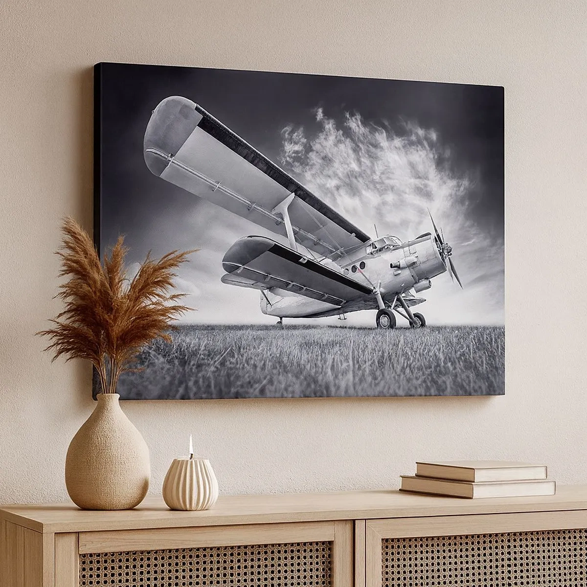 Tablou pe pânză Canvas - Un avion pe un cer dramatic în alb și negru - 70x50cm - Rătăcitorul înaripat - Decorațiune modernă pentru perete pentru living și dormitor ARTTOR