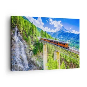 Tablou pe pânză Canvas - Un roller coaster pe un pod cu vedere la o cascadă și munți - 70x50cm - Calea ferată din Alpi - Decorațiune modernă pentru perete pentru living și dormitor ARTTOR