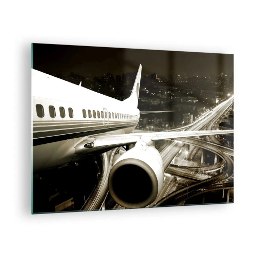 Tablou pe sticlă - Un avion deasupra orașului noaptea, cu o atmosferă industrială - 70x50cm - Zbor în noapte - Decorațiune modernă pentru perete pentru living și dormitor ARTTOR