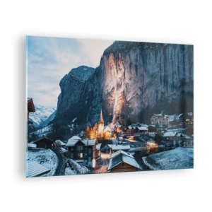 Tablou pe sticlă - Un sat de iarnă la poalele unei stânci iluminate - 70x50cm - Spiritul luminos al iernii - Decorațiune modernă pentru perete pentru living și dormitor ARTTOR