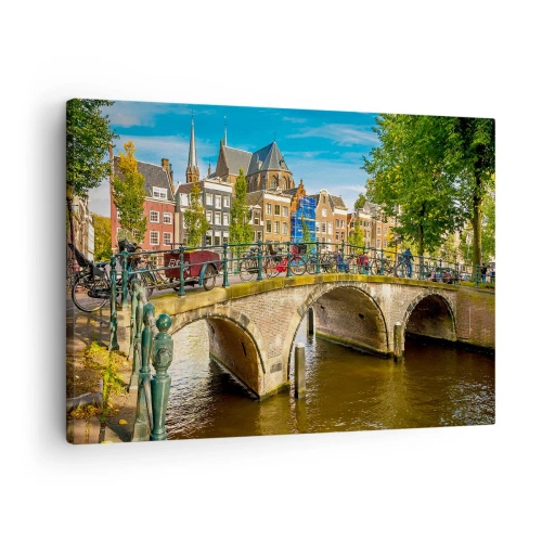 Tablou pe pânză Canvas - Un canal pitoresc cu un pod în Amsterdam - 70x50cm - Primăvara lângă canal - Decorațiune modernă pentru perete pentru living și dormitor ARTTOR