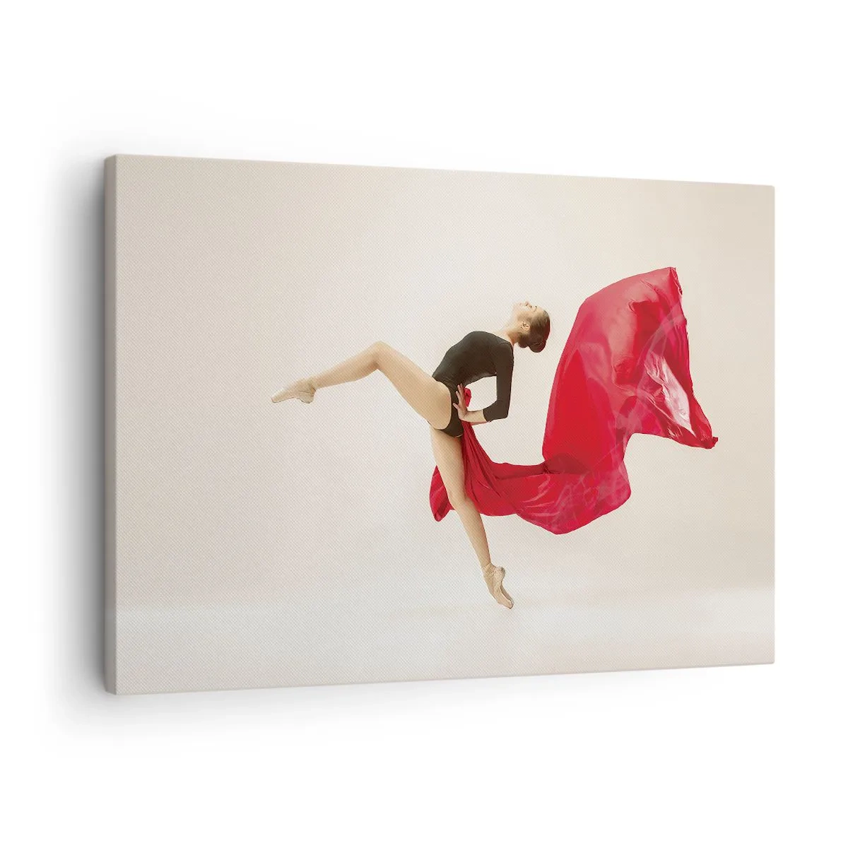 Tablou pe pânză Canvas - O dansatoare dinamică într-o ținută neagră și material roșu, în mișcare. - 70x50cm - Roșu și negru - Decorațiune modernă pentru perete pentru living și dormitor ARTTOR