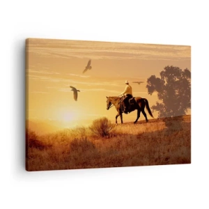 Tablou pe pânză Canvas - Un călăreț pe un cal la apus, pe fundalul preriei - 70x50cm - Singur peste prerie - Decorațiune modernă pentru perete pentru living și dormitor ARTTOR