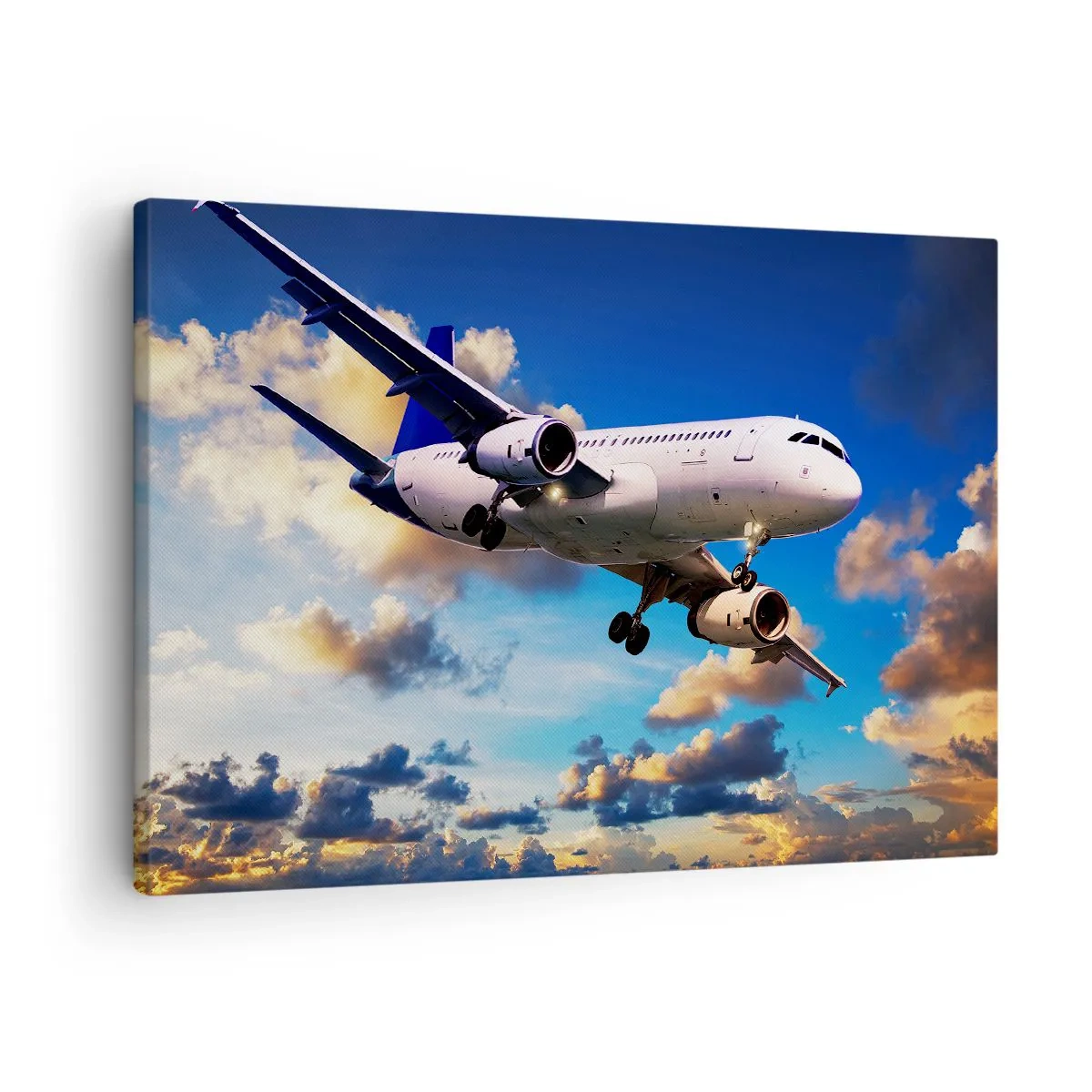 Tablou pe pânză Canvas - Un avion de pasageri pe fundalul norilor la apus - 70x50cm - Călătorie în alb și albastru - Decorațiune modernă pentru perete pentru living și dormitor ARTTOR