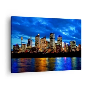 Tablou pe pânză Canvas - Panoramă a orașului nocturn cu zgârie-nori iluminați deasupra apei - 70x50cm - O noapte de lumini și culori - Decorațiune modernă pentru perete pentru living și dormitor ARTTOR