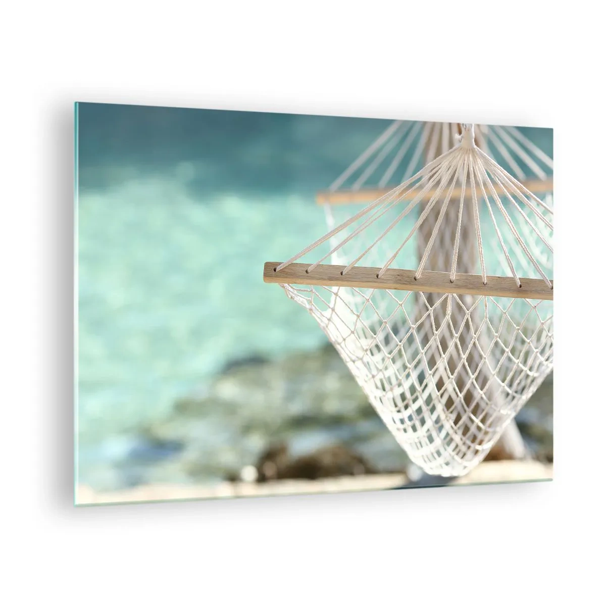 Tablou pe sticlă - Un hamac cu vedere la apele turcoaz cristaline - 70x50cm - Timp de relaxare - Decorațiune modernă pentru perete pentru living și dormitor ARTTOR