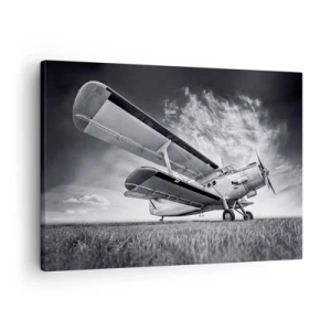 Tablou pe pânză Canvas - Un avion pe un cer dramatic în alb și negru - 70x50cm - Rătăcitorul înaripat - Decorațiune modernă pentru perete pentru living și dormitor ARTTOR