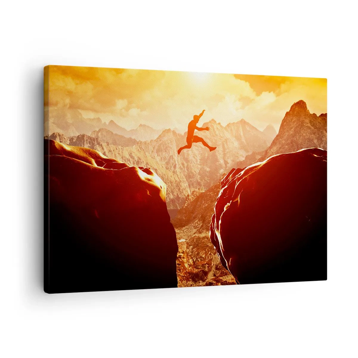 Tablou pe pânză Canvas - O figură sărind printre stânci cu munți în fundal - 70x50cm - Trecând frontierele - Decorațiune modernă pentru perete pentru living și dormitor ARTTOR