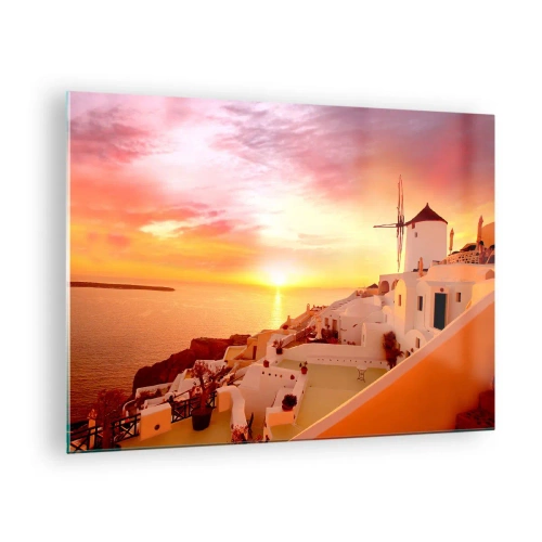 Tablou pe sticlă - Apus de soare peste Santorini cu clădiri albe și o moară de vânt - 70x50cm - Dizolvându-se în alb și auriu - Decorațiune modernă pentru perete pentru living și dormitor ARTTOR