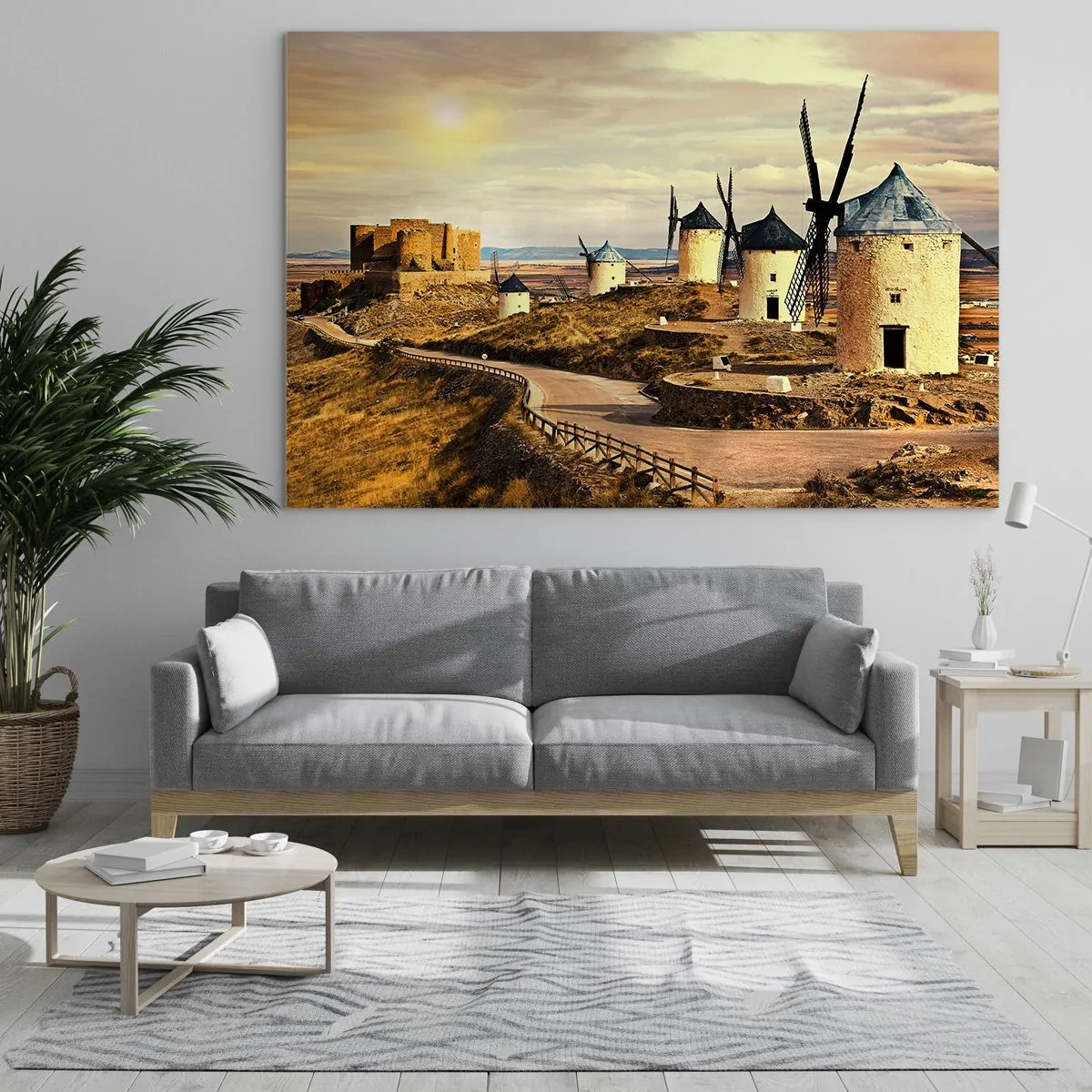 Tablou pe sticlă - Mori de vânt și un castel în peisaj la apus - 70x50cm - Don Quijote apare imediat - Decorațiune modernă pentru perete pentru living și dormitor ARTTOR