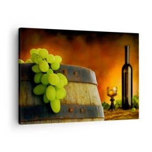 Tablou pe pânză Canvas - Struguri pe un butoi de vin cu o schemă de culori calde în fundal - 70x50cm - Natură moartă cu o sticlă de vin și un ciorchine de struguri - Decorațiune modernă pentru perete pentru living și dormitor ARTTOR