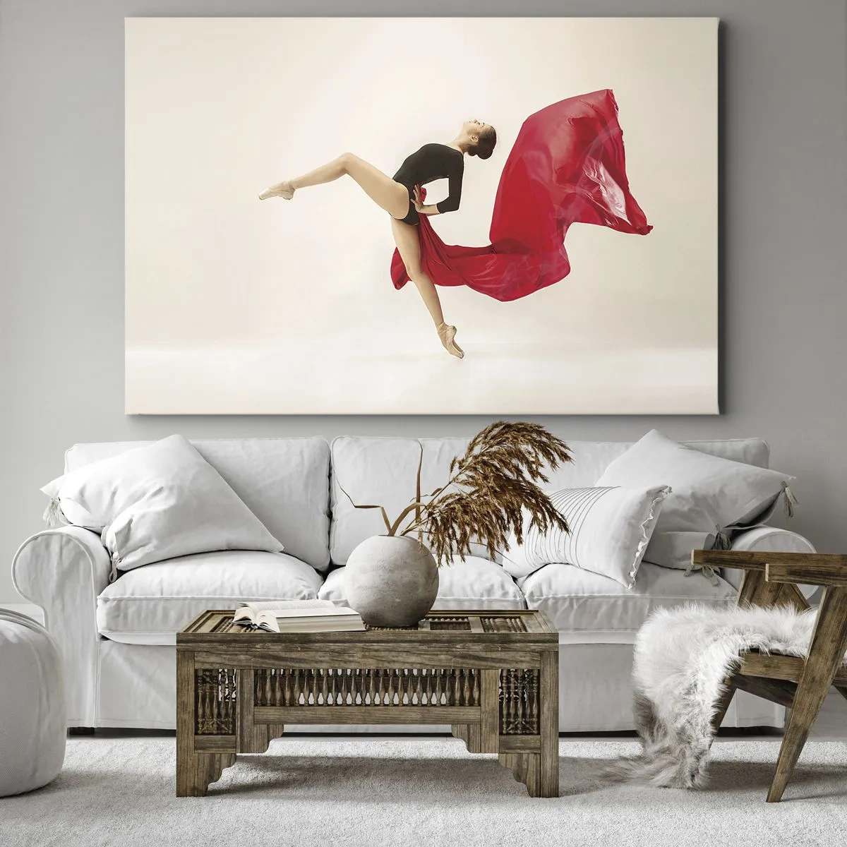 Tablou pe pânză Canvas - O dansatoare dinamică într-o ținută neagră și material roșu, în mișcare. - 70x50cm - Roșu și negru - Decorațiune modernă pentru perete pentru living și dormitor ARTTOR