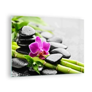 Tablou pe sticlă - Orhidee, pietre negre și bambus într-un aranjament liniștitor - 70x50cm - Într-un echilibru pașnic - Decorațiune modernă pentru perete pentru living și dormitor ARTTOR