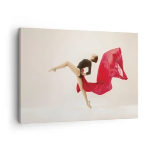 Tablou pe pânză Canvas - O dansatoare dinamică într-o ținută neagră și material roșu, în mișcare. - 70x50cm - Roșu și negru - Decorațiune modernă pentru perete pentru living și dormitor ARTTOR