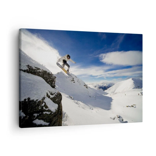 Tablou pe pânză Canvas - Un snowboarder sare de pe o stâncă cu munți acoperiți de zăpadă în fundal. - 70x50cm - Libertate fără frontiere - Decorațiune modernă pentru perete pentru living și dormitor ARTTOR