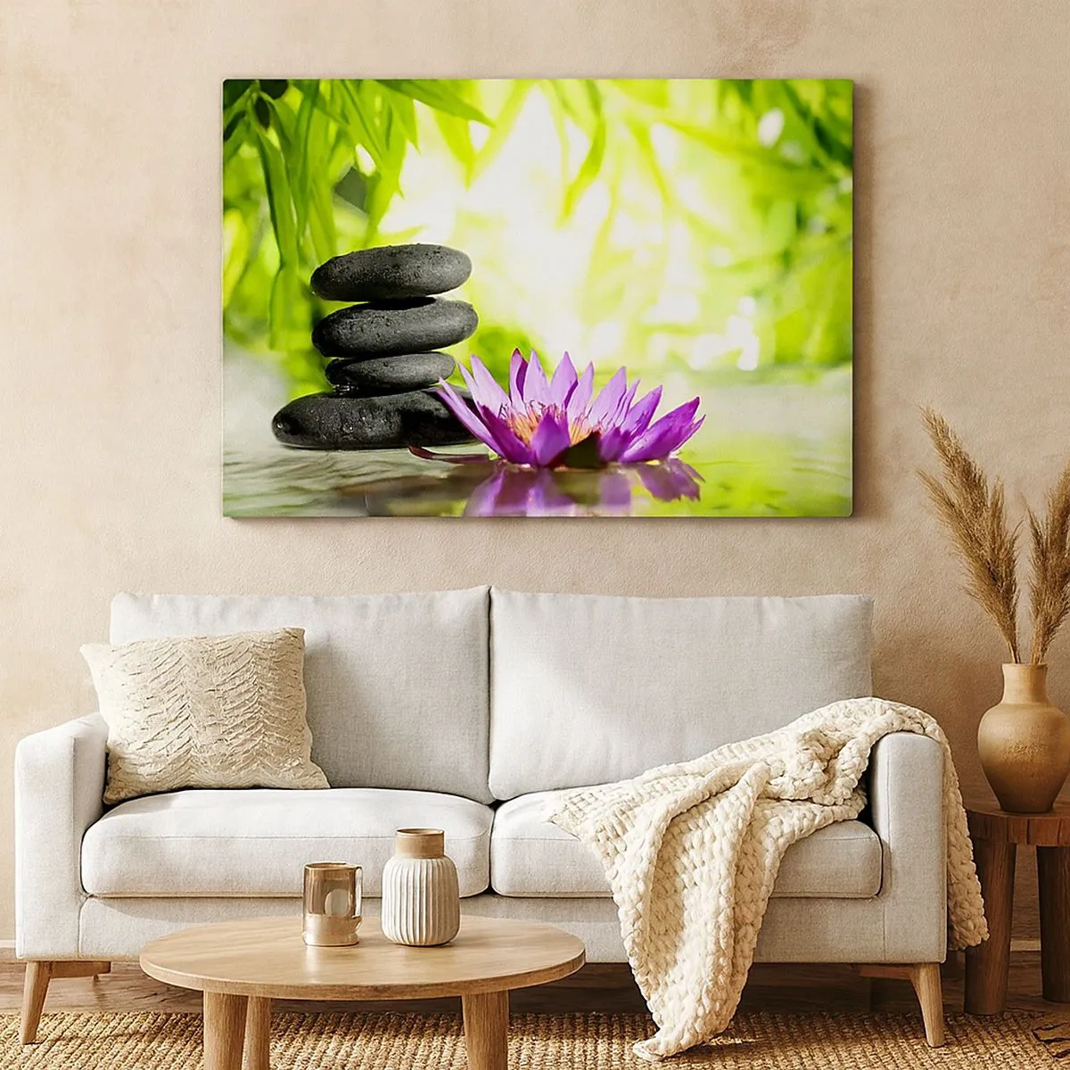 Tablou pe pânză Canvas - O grămadă de pietre zen și o floare de lotus pe un fundal de frunze de bambus. - 70x50cm - Într-o colibă de bambus - Decorațiune modernă pentru perete pentru living și dormitor ARTTOR