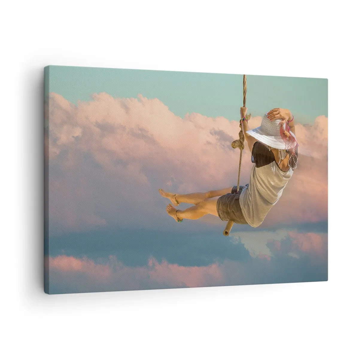 Tablou pe pânză Canvas - Femeie pe un leagăn printre nori roz - 70x50cm - Distracție în nori - Decorațiune modernă pentru perete pentru living și dormitor ARTTOR