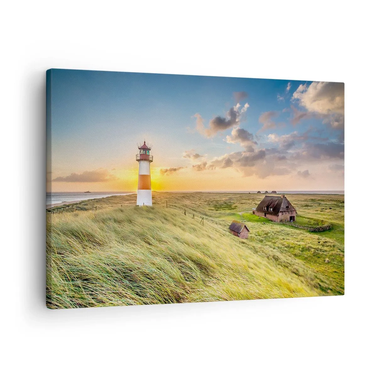 Tablou pe pânză Canvas - Un far cu pajiști și case la soare în fundal - 70x50cm - Între valuri - Decorațiune modernă pentru perete pentru living și dormitor ARTTOR