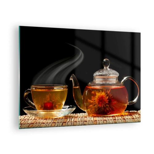Tablou pe sticlă - Un ulcior de sticlă și o ceașcă de ceai cu o floare pe fundal negru - 70x50cm - Magia și arta preparării ceaiului - Decorațiune modernă pentru perete pentru living și dormitor ARTTOR