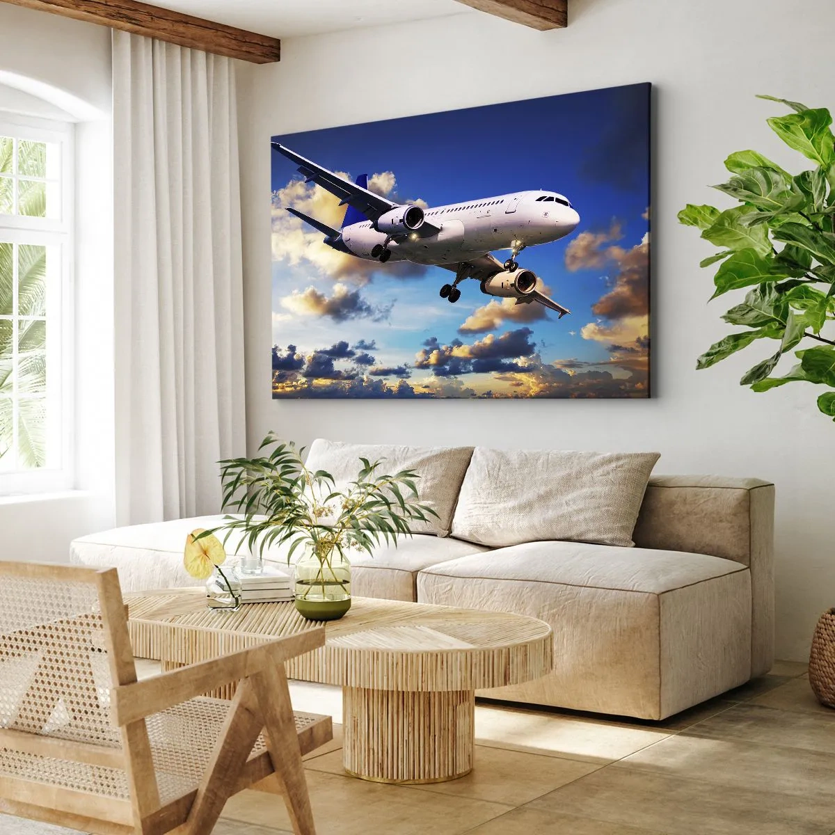 Tablou pe pânză Canvas - Un avion de pasageri pe fundalul norilor la apus - 70x50cm - Călătorie în alb și albastru - Decorațiune modernă pentru perete pentru living și dormitor ARTTOR