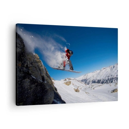 Tablou pe pânză Canvas - Un snowboarder sare de pe o stâncă pe un peisaj montan - 70x50cm - Și ai devenit parte din spațiul - Decorațiune modernă pentru perete pentru living și dormitor ARTTOR