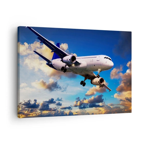 Tablou pe pânză Canvas - Un avion de pasageri pe fundalul norilor la apus - 70x50cm - Călătorie în alb și albastru - Decorațiune modernă pentru perete pentru living și dormitor ARTTOR