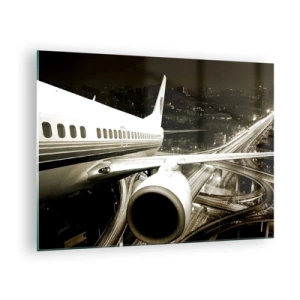 Tablou pe sticlă - Un avion deasupra orașului noaptea, cu o atmosferă industrială - 70x50cm - Zbor în noapte - Decorațiune modernă pentru perete pentru living și dormitor ARTTOR
