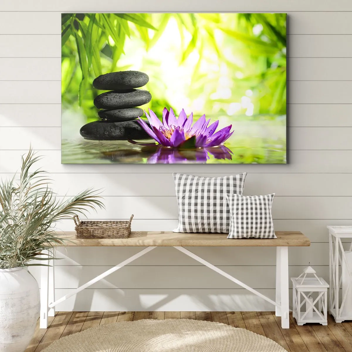 Tablou pe pânză Canvas - O grămadă de pietre zen și o floare de lotus pe un fundal de frunze de bambus. - 70x50cm - Într-o colibă de bambus - Decorațiune modernă pentru perete pentru living și dormitor ARTTOR